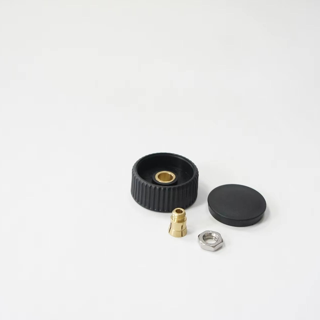 Handwheel with Brass Lining for Total Station parts including black plastic wheel and brass components.