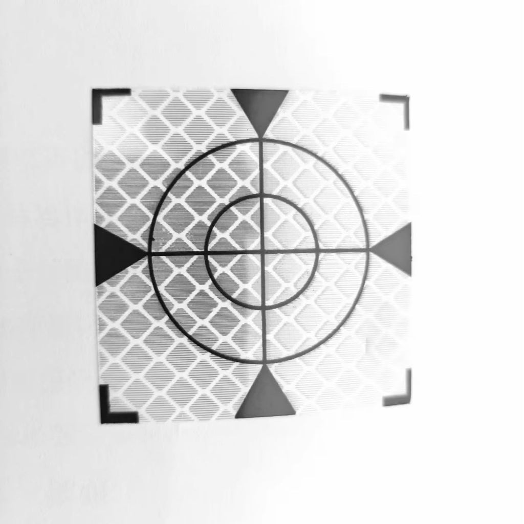 Diamond Grade PMMA Reflective Sheet 3cmx3cm showing high-visibility retro-reflective target for surveying use.